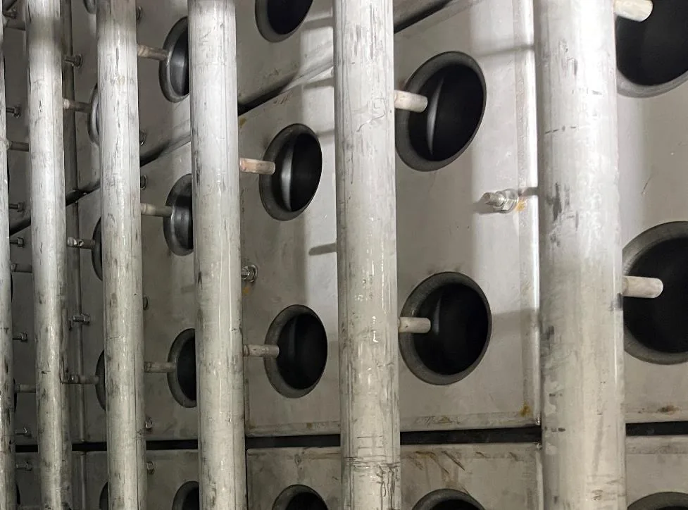 Ceramic filter tubes installed in rows inside a high-temperature filter compartment