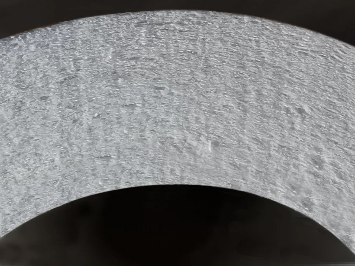 Cross-section of a catalytic ceramic filter wall showing the catalyst-loaded fiber structure
