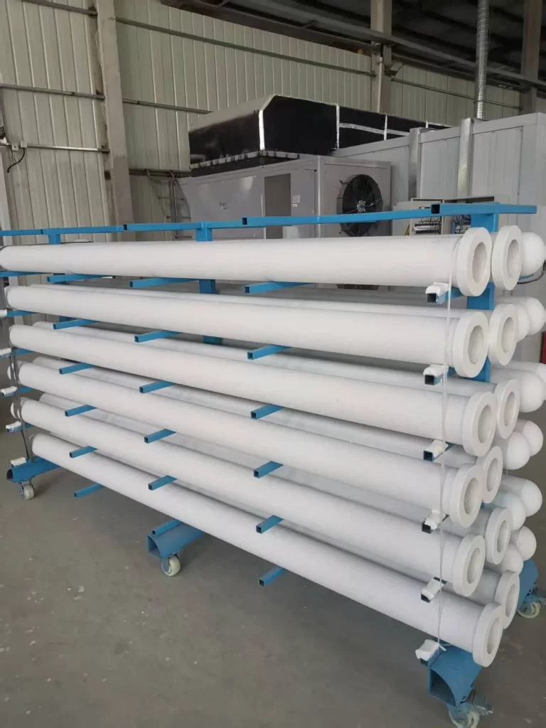 Fresh ceramic filter tubes unwrapped and stacked before pre-coating