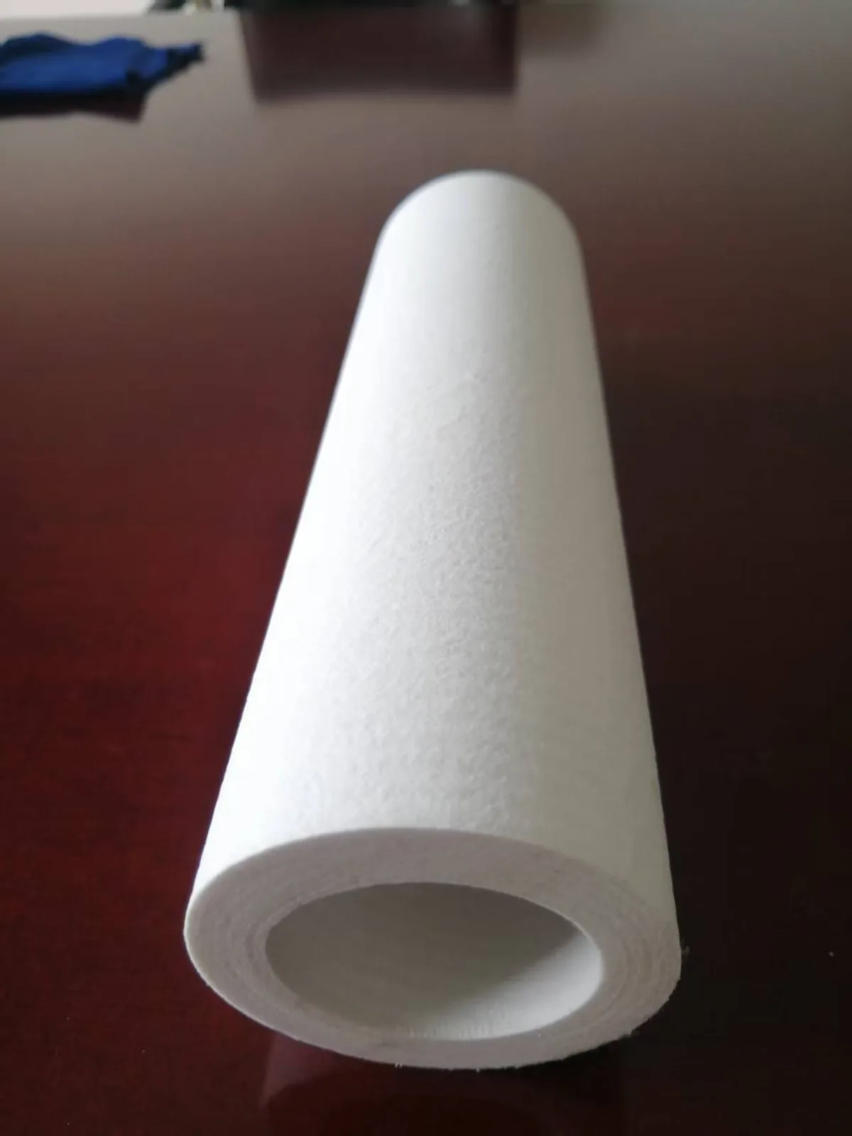 Close-up of a catalytic ceramic fiber filter element on an inspection bench